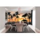 Wall murals sea coast palms with a city at night view