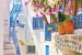 Wall murals Santorini street with flowers