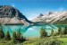 Wall mural Mountains overlooking the lake with pine trees