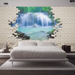 Wallpapers mural view of a waterfall through a brick wall