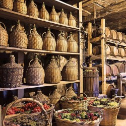 Wall mural Winery demijohns and baskets full of grapes